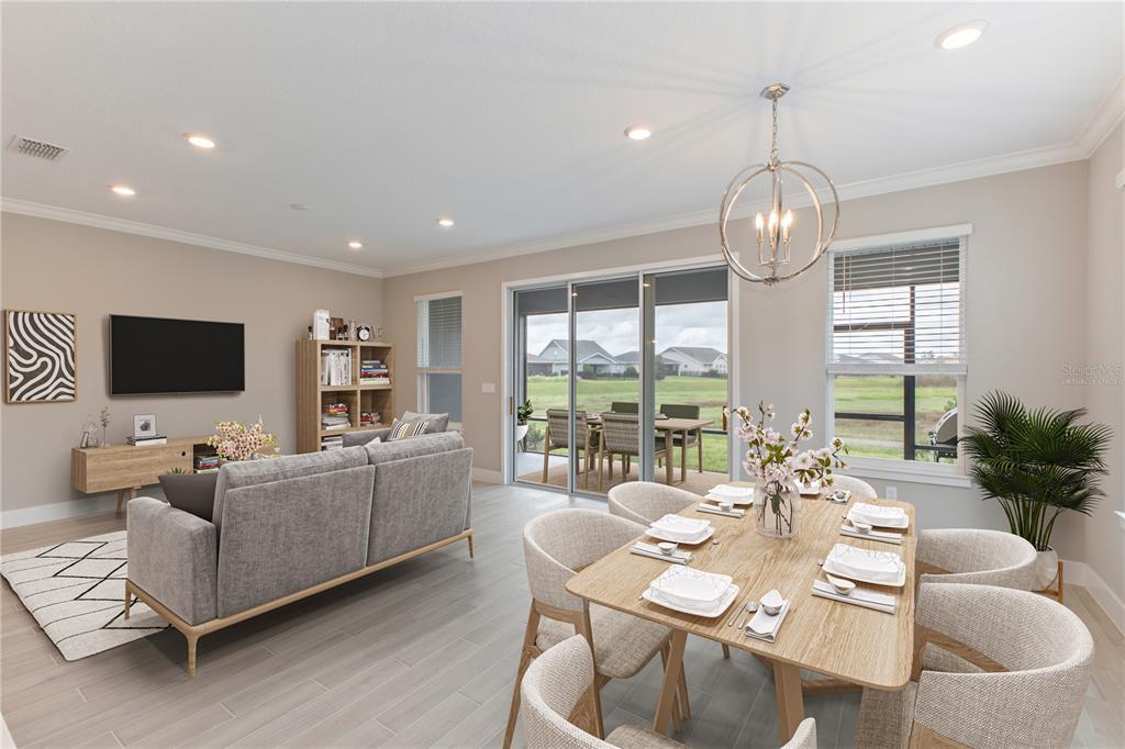 4516 Northwest 54th Terrace Ocala, FL 34482 - Photo 15 of 32 a living room with furniture flat screen tv and a large window