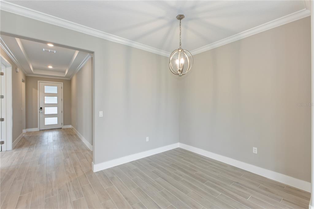 4516 Northwest 54th Terrace Ocala, FL 34482 - Photo 8 of 25 a view of empty room with wooden floor