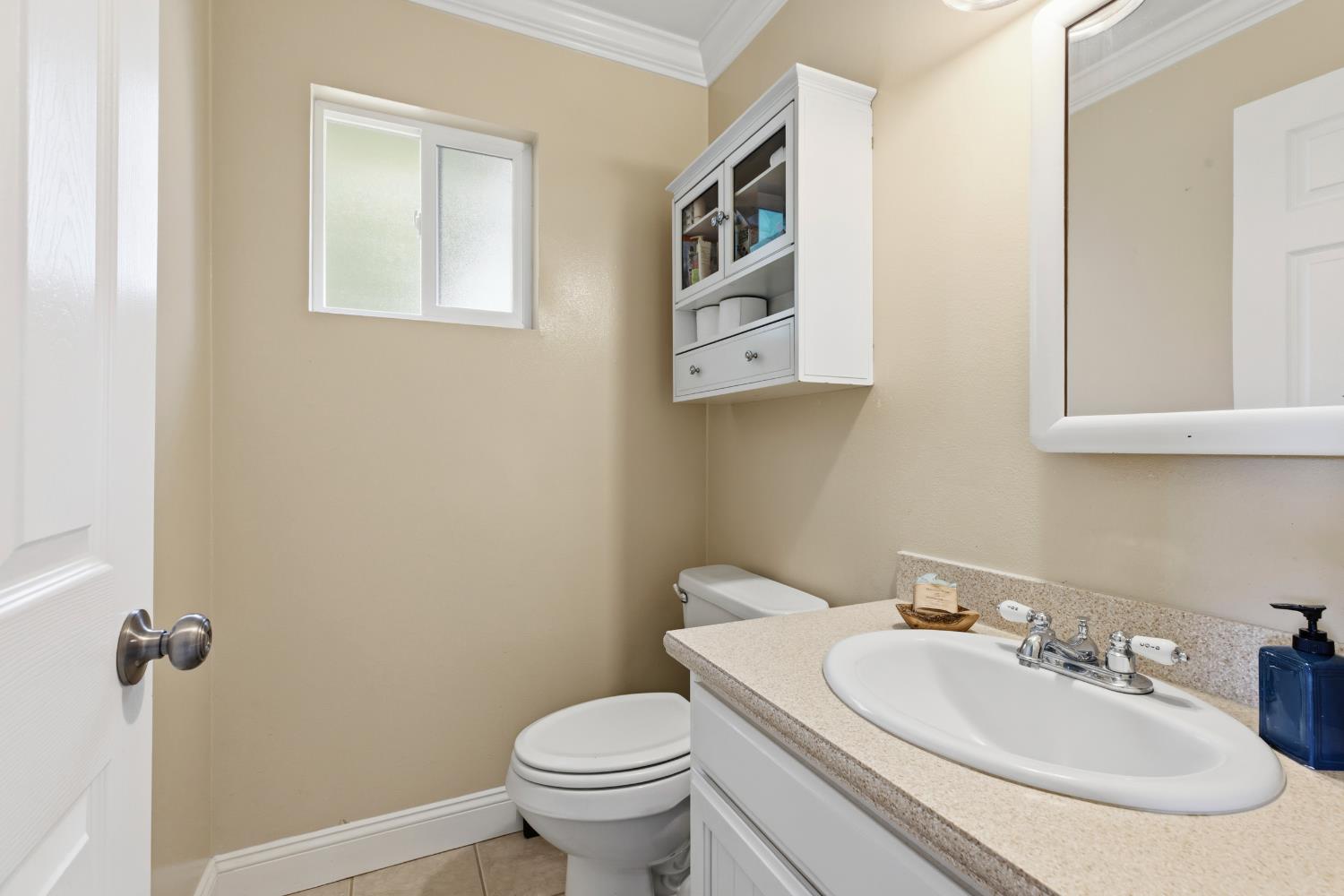 550 Bell Street Turlock, CA 95380 - Photo 16 of 36 a bathroom with a sink and a toilet