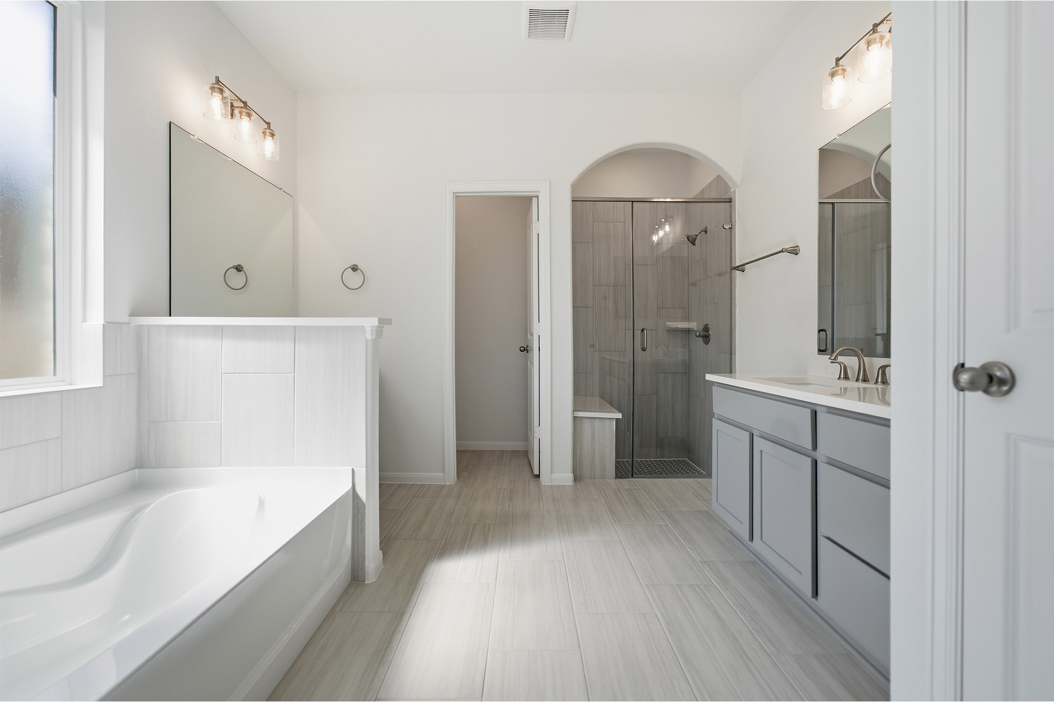359 Grey Leaf Road Buda, TX 78610 - Photo 26 of 37 Full bathroom featuring vanity, a stall shower, and a bath