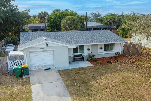 an aerial view of residential houses with outdoor space and swimming pool