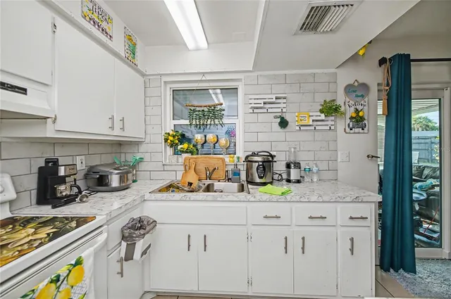 a bedroom with a bed and a chair