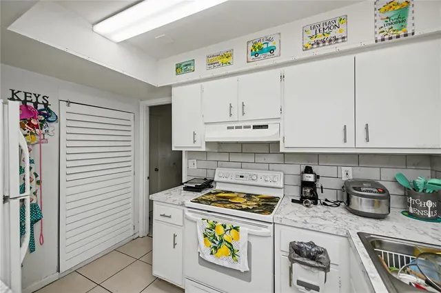 a view of a table and chairs under an umbrella