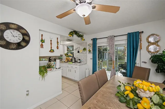 a view of a house with backyard porch and sitting area