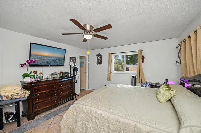 a view of a house with backyard porch and sitting area