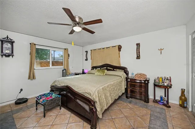 a view of a backyard with a slide trees and wooden fence