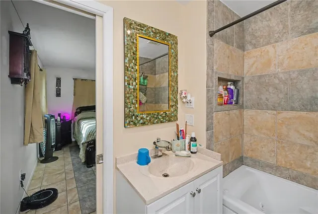 an aerial view of residential houses with outdoor space and lake view