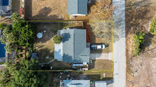 a living room with furniture and flowers
