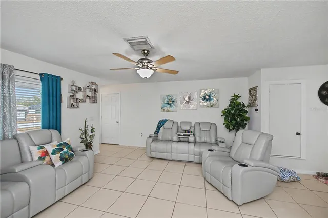a bedroom with a bed and flat screen tv