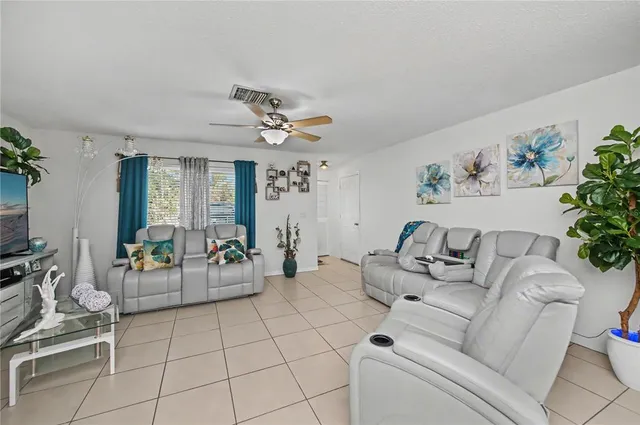 a white toilet sitting next to a bathroom sink and a shower curtain