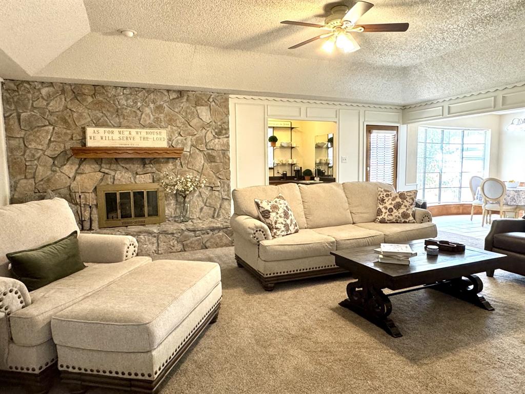 113 Northeast Timber Ridge Drive Burleson, TX 76028 - Photo 5 of 36 Spacious living area featuring a STONE fireplace with GAS LOGS... hook-up for Propane Tank outside OR Wood-Burning.