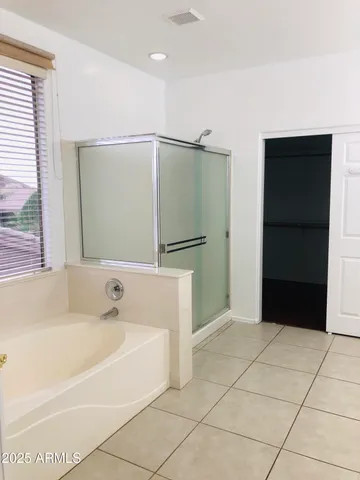 a bathroom with a double vanity sink and mirror