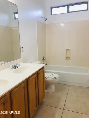 a view of a room with wooden floor and cabinet