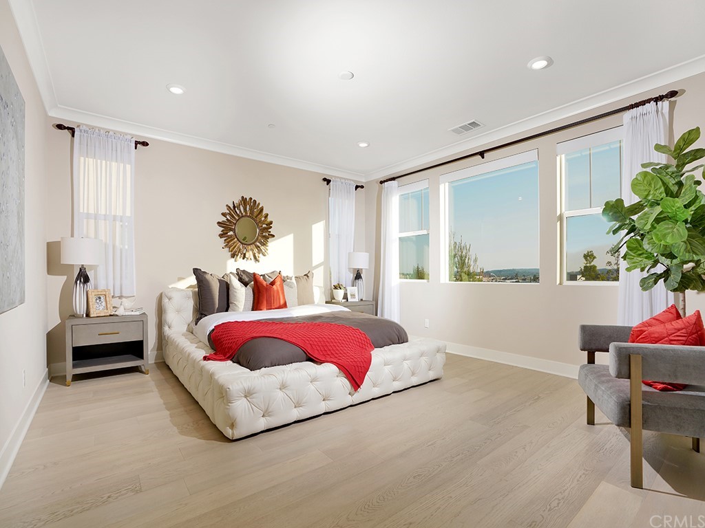 92 Iluna Irvine, CA 92618 - Photo 22 of 45 a bed room with a bed and a couch