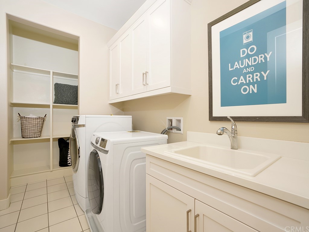 92 Iluna Irvine, CA 92618 - Photo 27 of 45 a view of a kitchen with sink washer and dryer