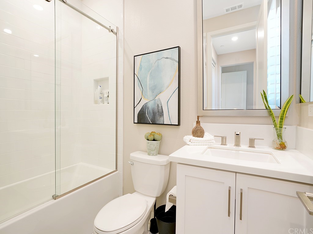 92 Iluna Irvine, CA 92618 - Photo 31 of 45 a bathroom with a sink toilet and shower