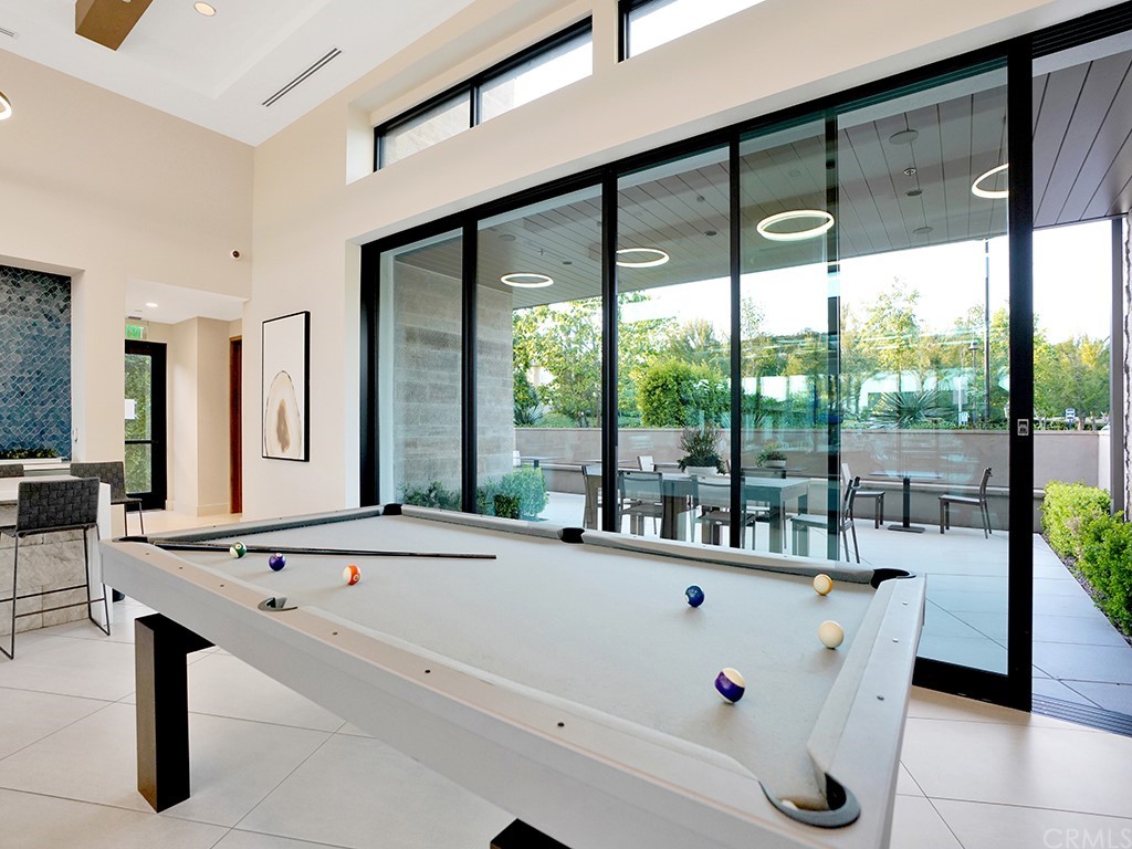 92 Iluna Irvine, CA 92618 - Photo 40 of 45 a view of an outdoor kitchen with a table and chairs