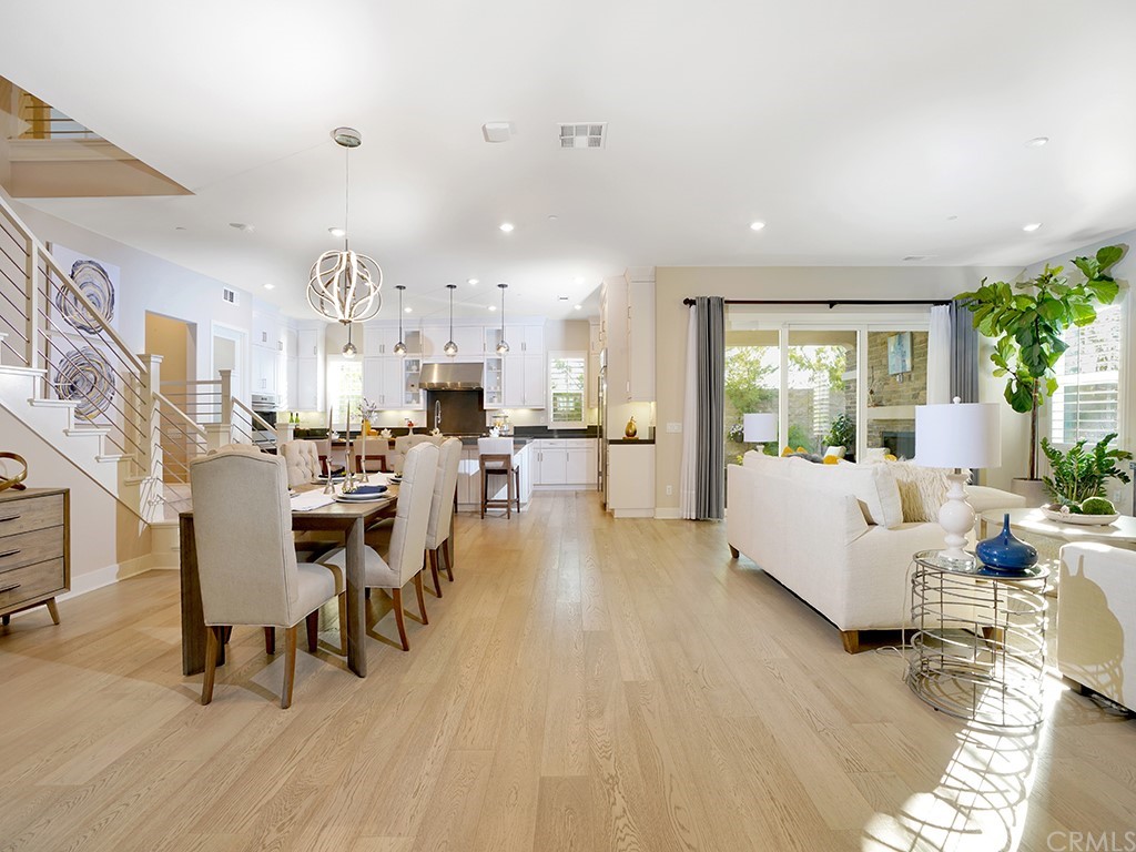 92 Iluna Irvine, CA 92618 - Photo 7 of 45 a living room with lots of furniture and a wooden floor