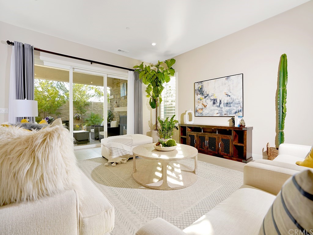 92 Iluna Irvine, CA 92618 - Photo 10 of 45 a living room with furniture and a large window