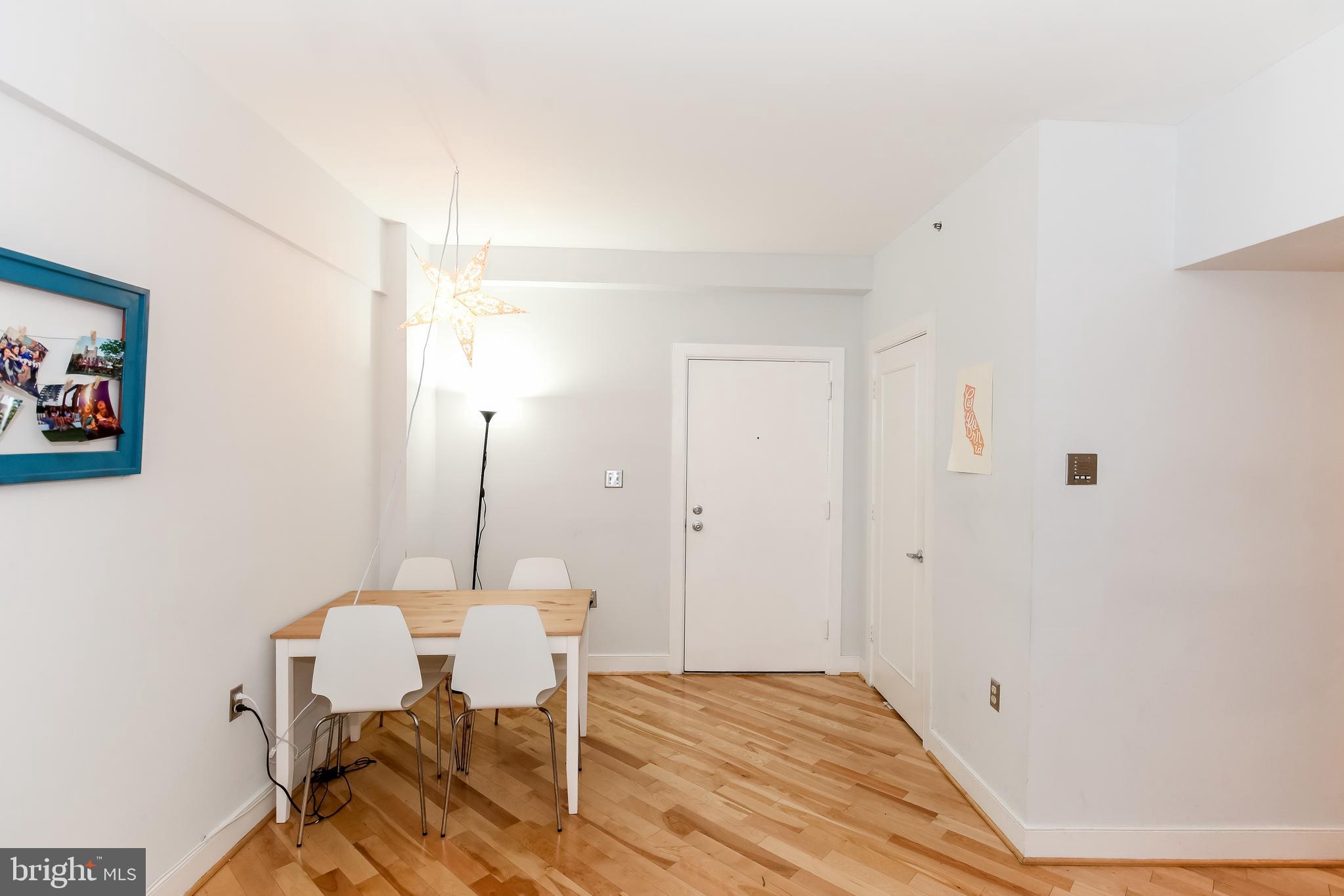 1727 R Street Northwest, Unit 203 Washington, DC 20009 - Photo 6 of 14 a view of a workspace with furniture and wooden floor