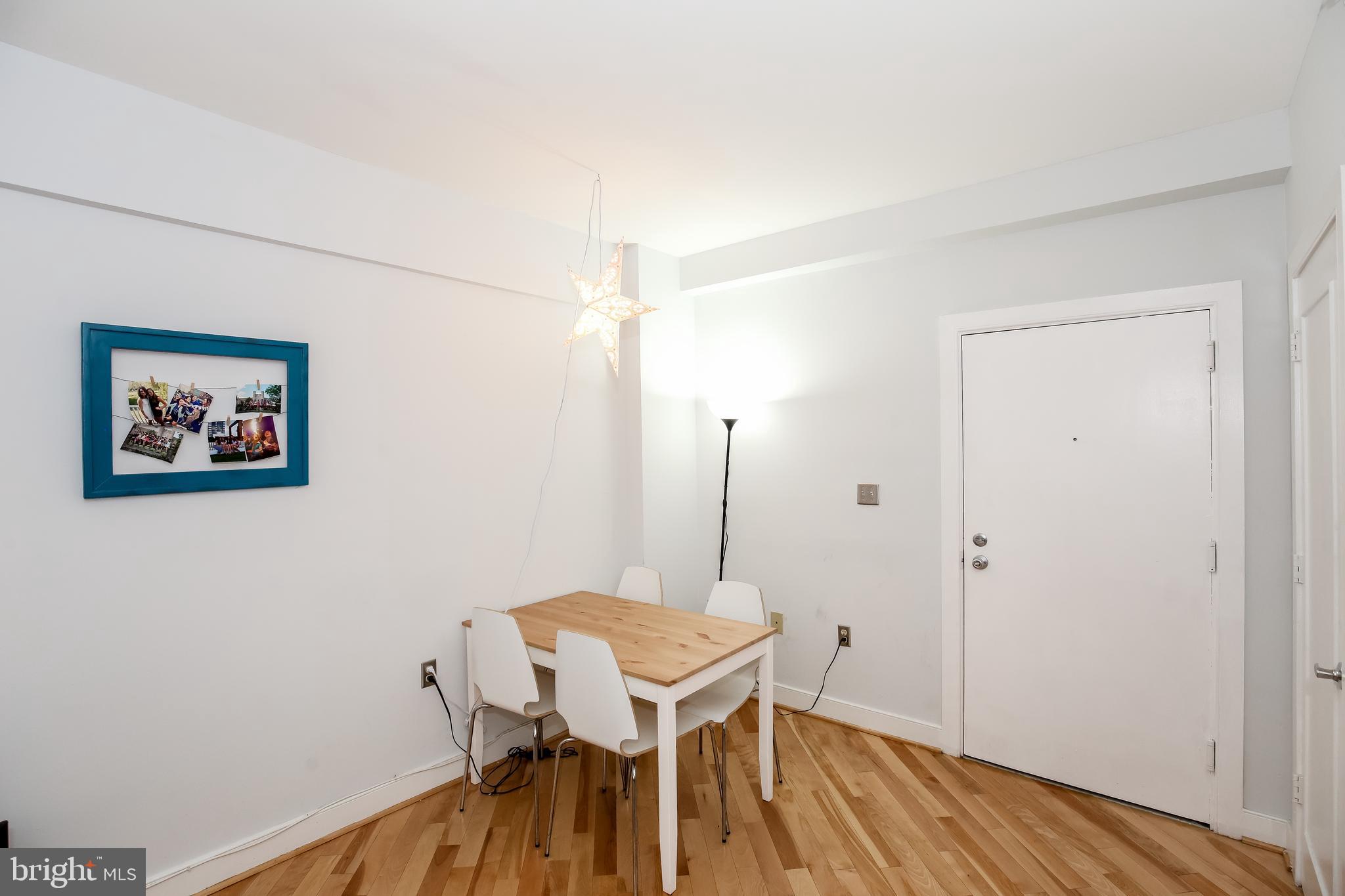 1727 R Street Northwest, Unit 203 Washington, DC 20009 - Photo 7 of 14 a view of a room with a table and chairs