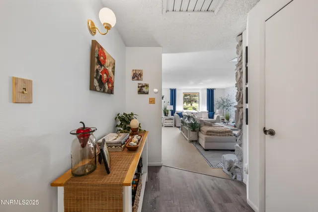 a living room with furniture and flowers