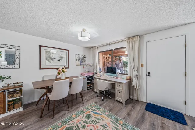 a view of a dining room with furniture window and wooden floor