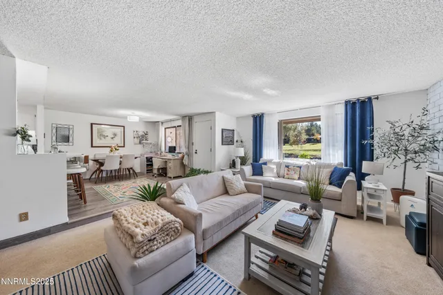 a living room with furniture or couch and a window