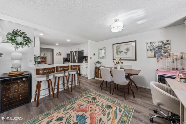 a view of a dining room with furniture and a fireplace