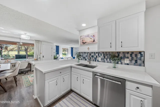 a kitchen with a sink and cabinets