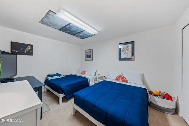 a theatre with furniture and wooden floor