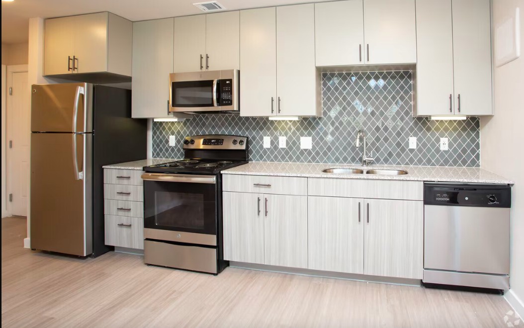 1800 South I- 35 Service Road Austin, TX 78748 - Photo 8 of 21 a kitchen with stainless steel appliances a stove microwave and refrigerator