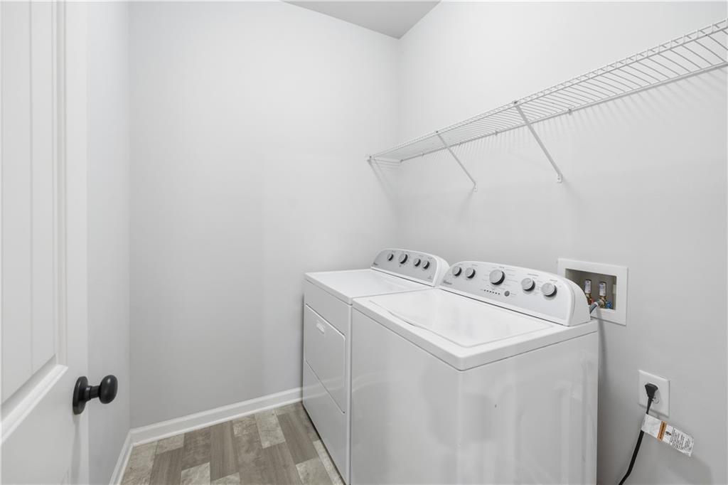 3244 Hawthorne Path Braselton, GA 30517 - Photo 26 of 48 a utility room with dryer and washer