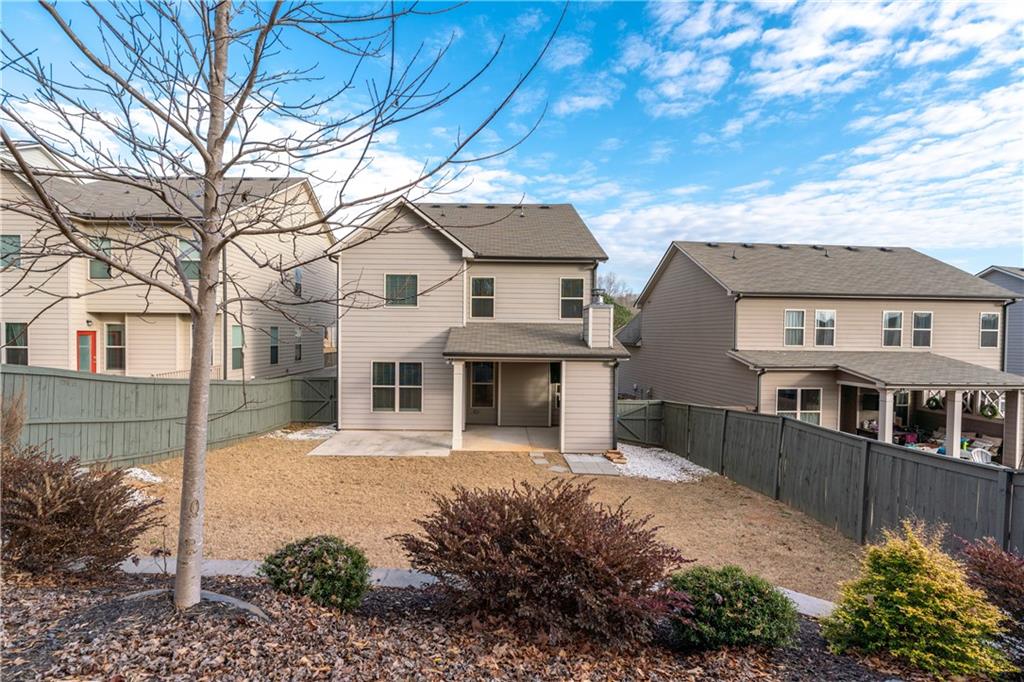 3244 Hawthorne Path Braselton, GA 30517 - Photo 48 of 48 a front view of a house with a garden