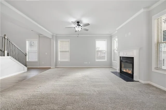 a view of a livingroom with a fireplace and window
