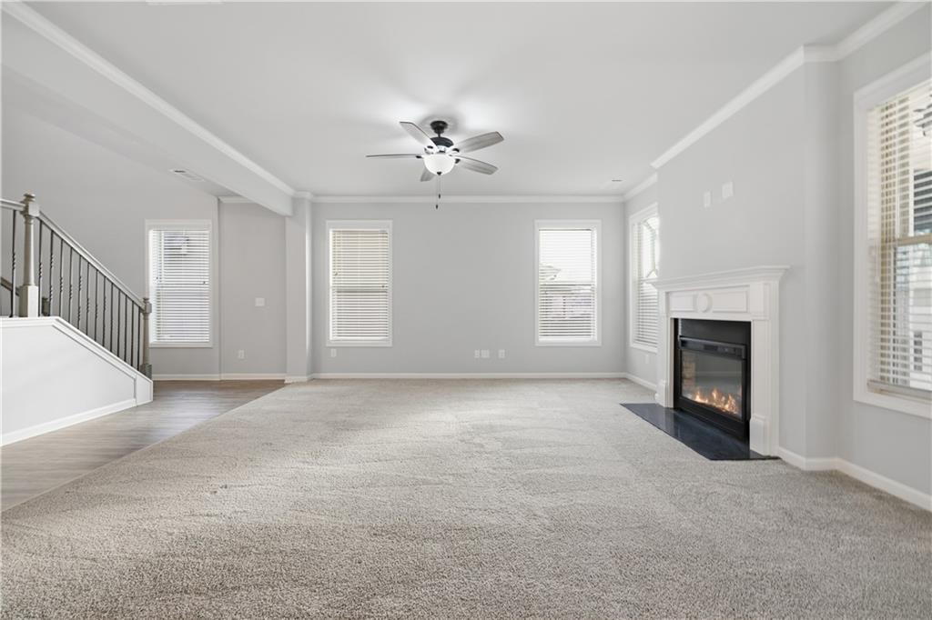 3244 Hawthorne Path Braselton, GA 30517 - Photo 7 of 48 a view of a livingroom with a fireplace and window