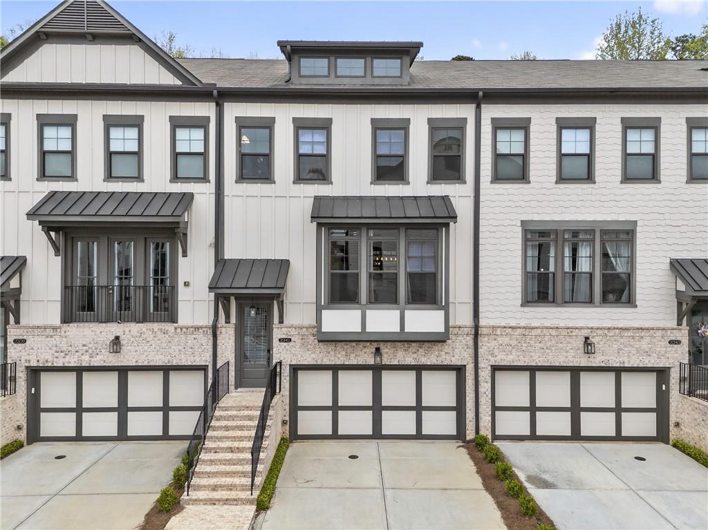 2341 Medlock Lane Decatur, GA 30033 - Photo 1 of 37 a view of a brick house with many windows
