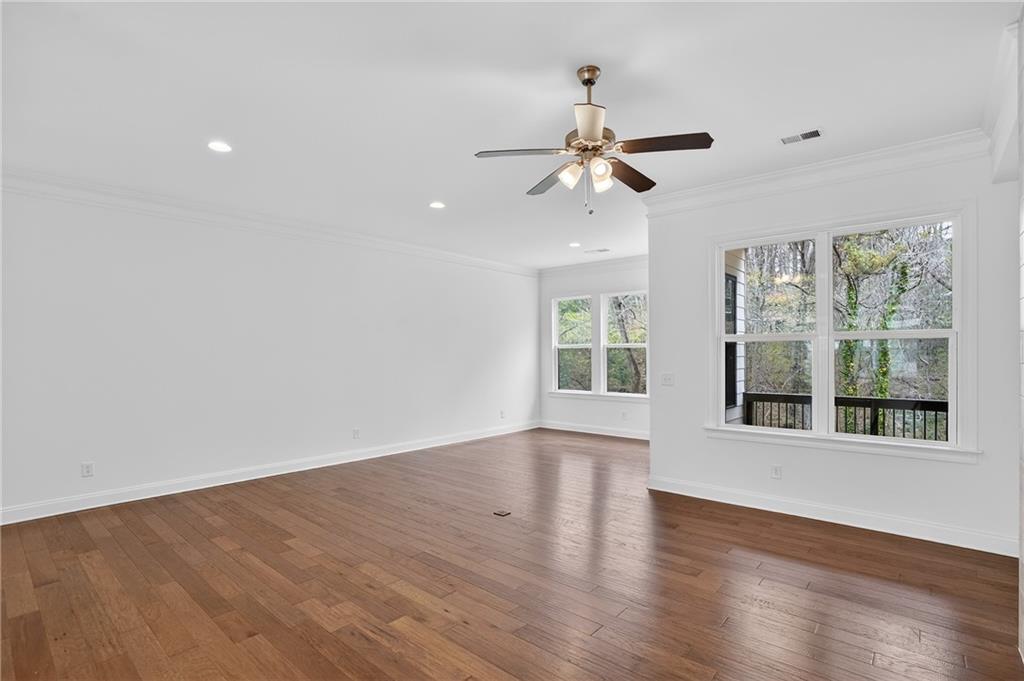 2341 Medlock Lane Decatur, GA 30033 - Photo 12 of 37 a view of an empty room with wooden floor and a window