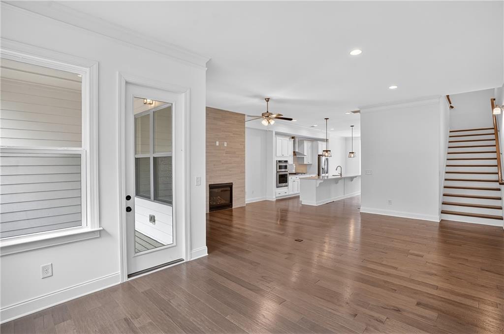 2341 Medlock Lane Decatur, GA 30033 - Photo 16 of 37 a view of open kitchen with white cabinets and wooden floor