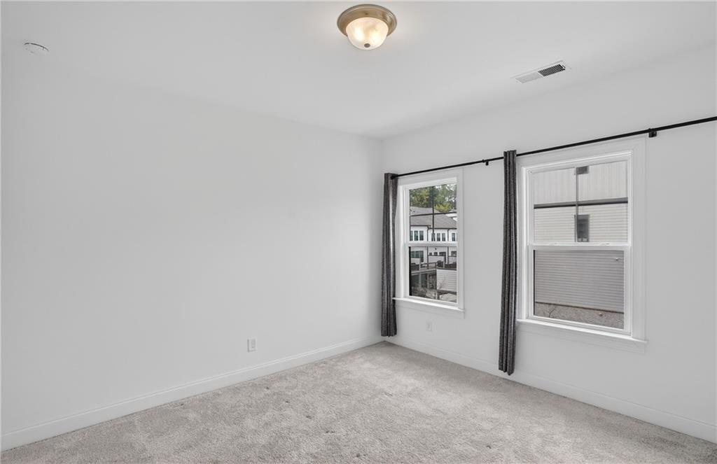2341 Medlock Lane Decatur, GA 30033 - Photo 25 of 37 a view of an empty room with a window