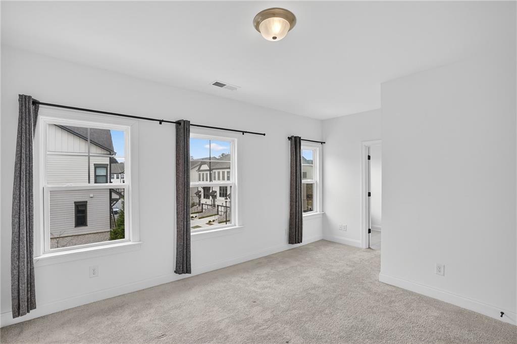 2341 Medlock Lane Decatur, GA 30033 - Photo 26 of 37 an empty room with windows and closet