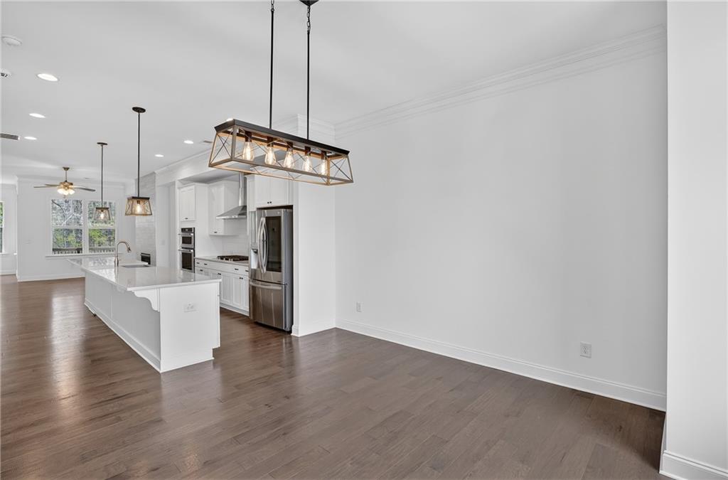 2341 Medlock Lane Decatur, GA 30033 - Photo 8 of 37 a view of a kitchen with center island and wooden floor