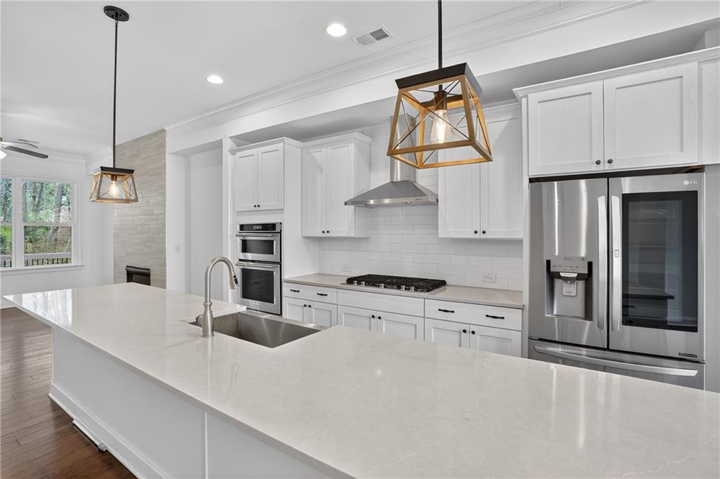2341 Medlock Lane Decatur, GA 30033 - Photo 9 of 37 a kitchen with stainless steel appliances granite countertop a sink a stove and a refrigerator