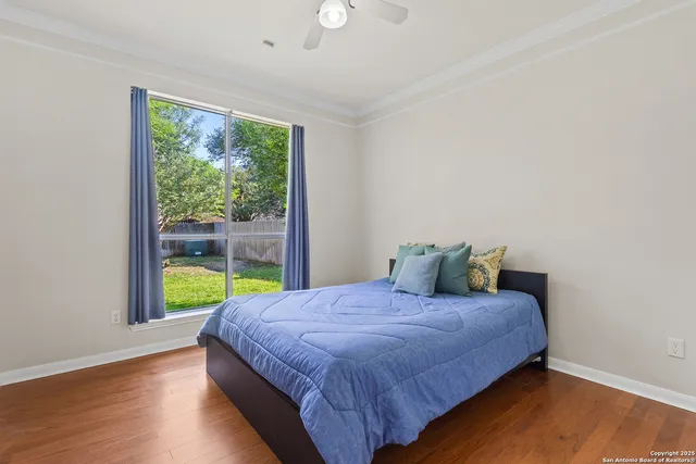 a bedroom with a bed and a window