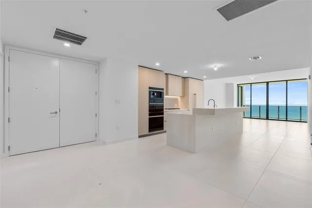 a kitchen with a sink and refrigerator