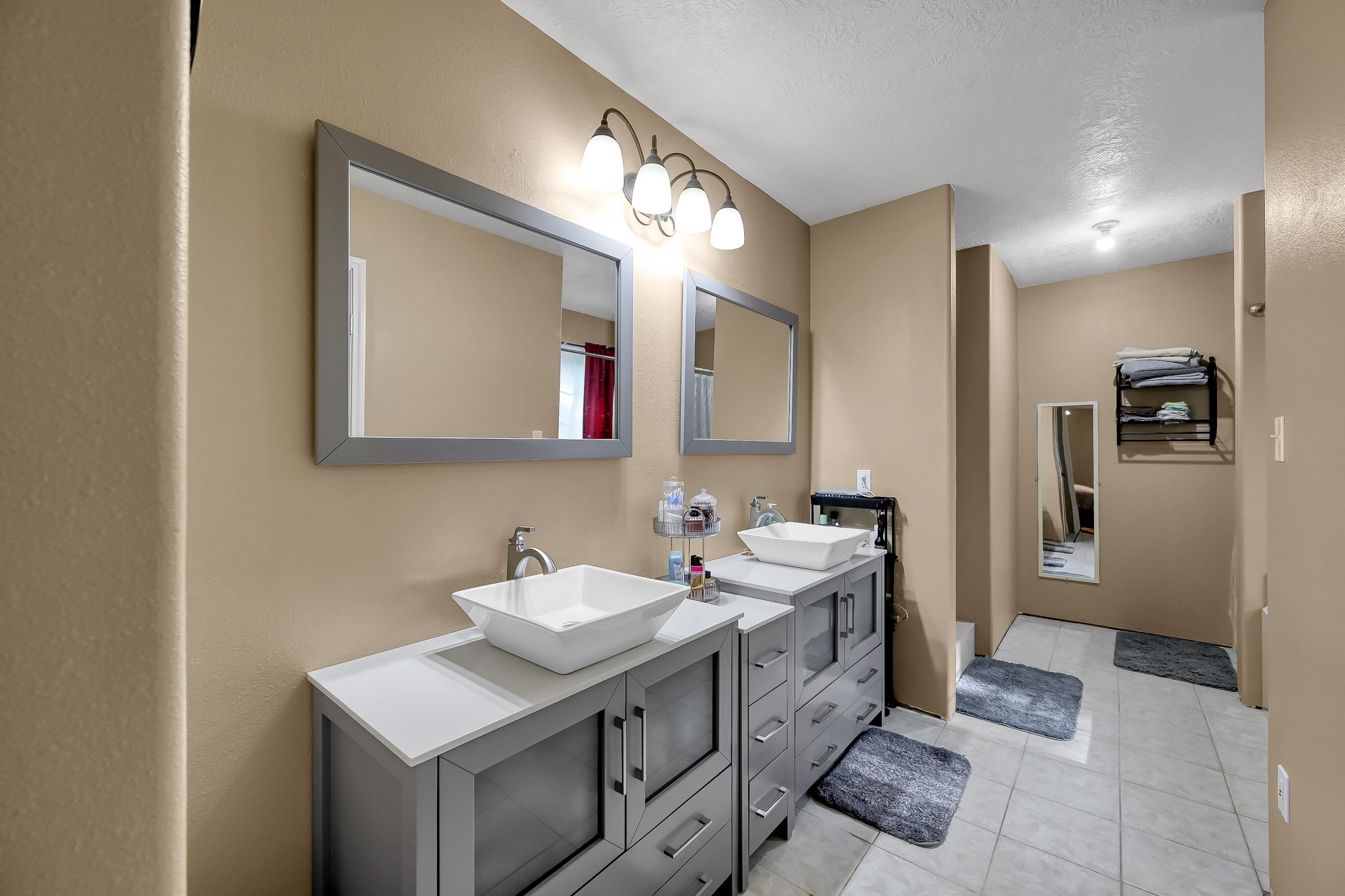 261 Franklyn Road Coldspring, TX 77331 - Photo 11 of 19 Primary bathroom featuring dual sinks, soaking tub, and separate shower for comfort and convenience.
