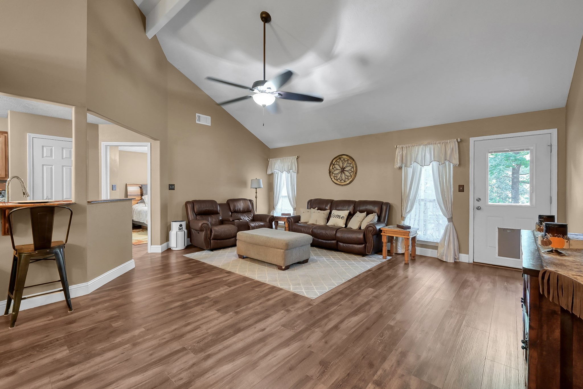 261 Franklyn Road Coldspring, TX 77331 - Photo 4 of 19 When you walk in the front door, the space opens to a living and dining combo with vaulted ceilings, upgraded vinyl plank flooring, and an open layout to the kitchen—ideal for entertaining and not missing a moment.