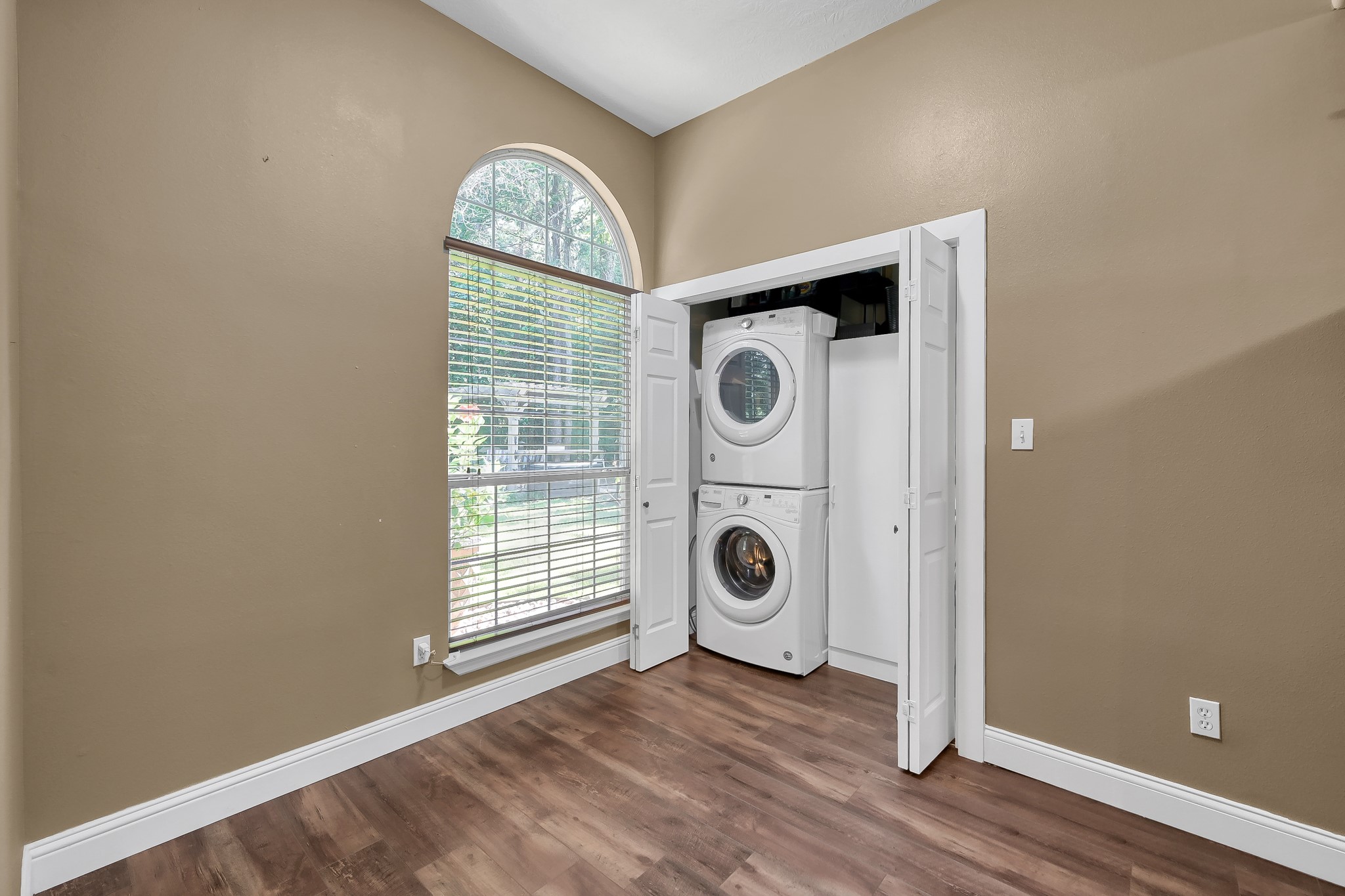 261 Franklyn Road Coldspring, TX 77331 - Photo 9 of 19 Dedicated laundry area with washer and dryer included, plus shelving for extra storage and easy access from the kitchen.
