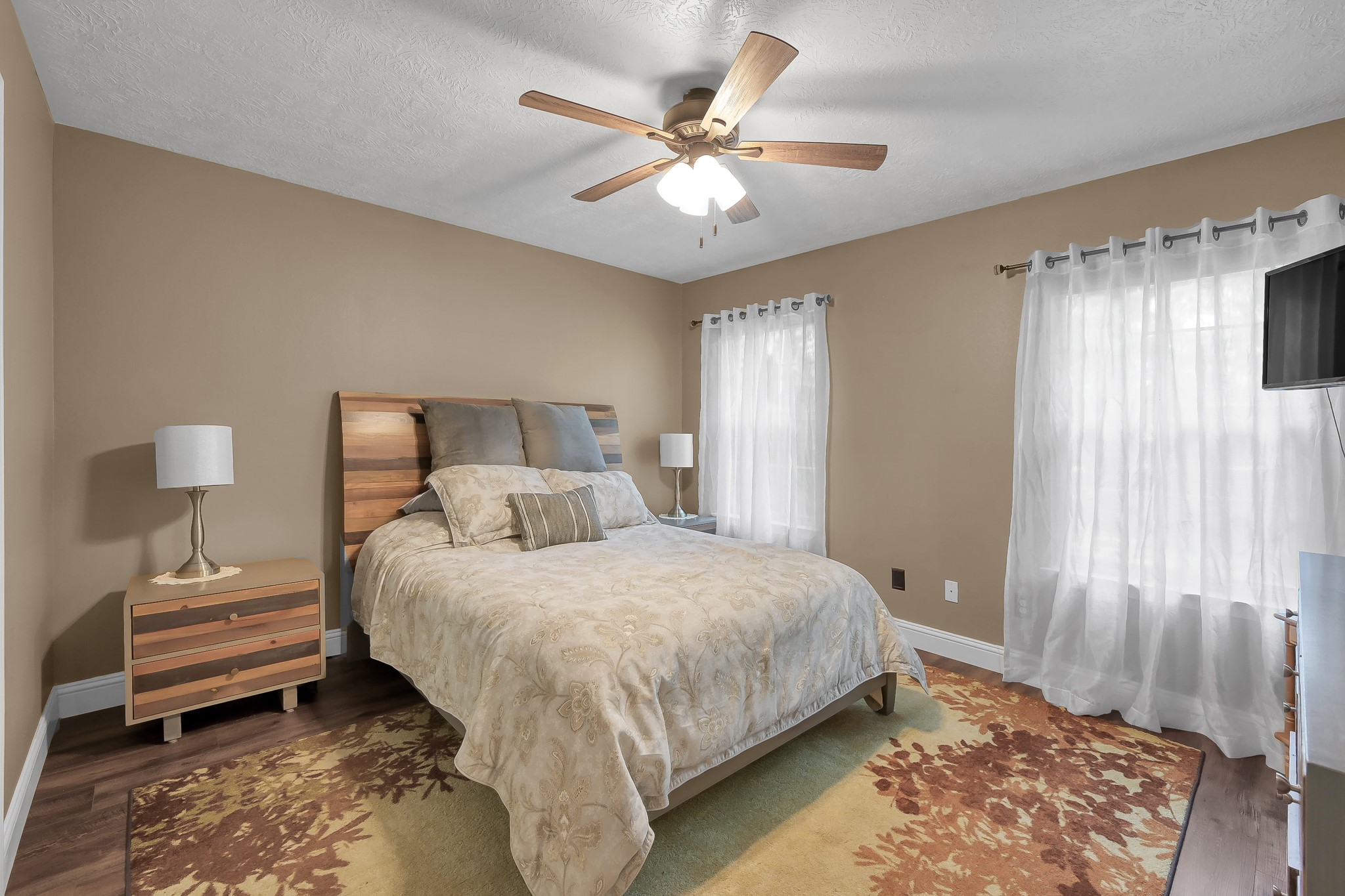 261 Franklyn Road Coldspring, TX 77331 - Photo 10 of 19 Spacious primary bedroom with a large window bringing in natural light, perfect for a relaxing retreat.