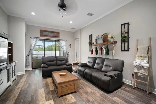 a dining room with stainless steel appliances kitchen island a table and chairs